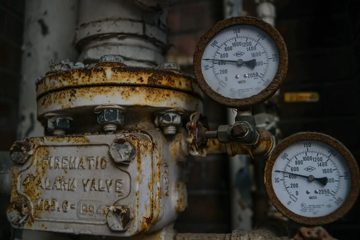 Rusty pressure relief valve with two analog pressure gauges